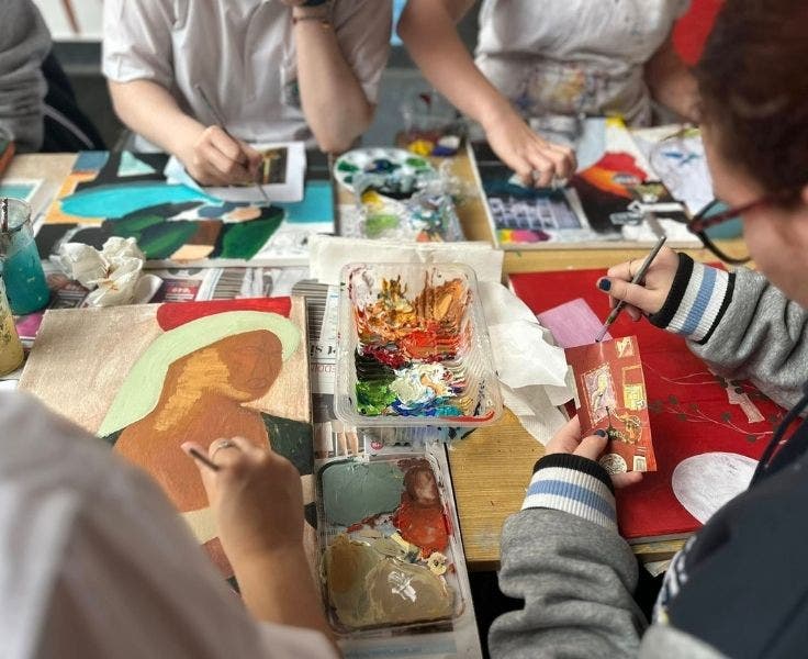 A group of students painting