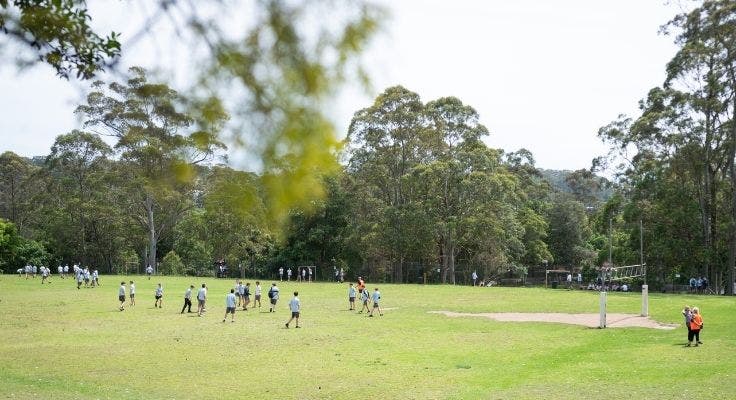 Students playing on oval at lunch time